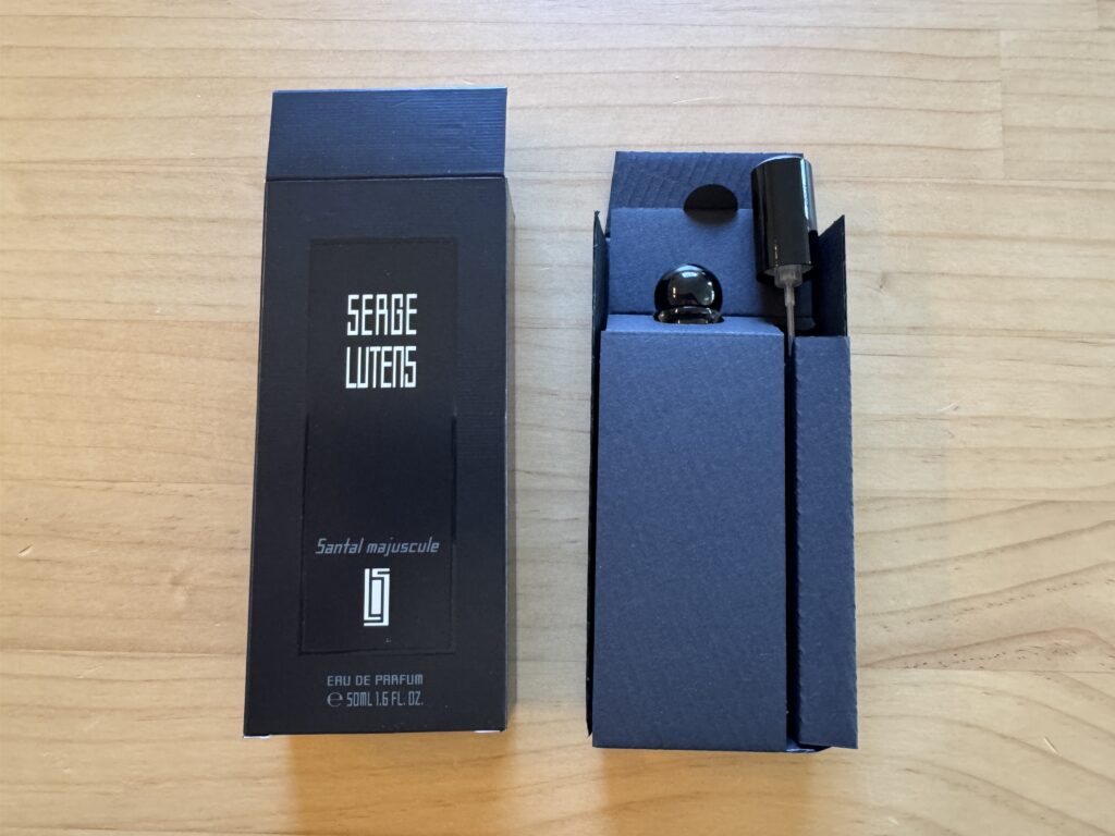 Serge Lutens Santal Majuscule perfume box opened showing bottle and spray nozzle