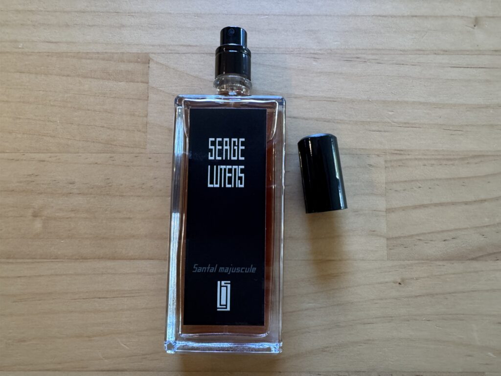 Serge Lutens Santal Majuscule perfume bottle with spray nozzle exposed