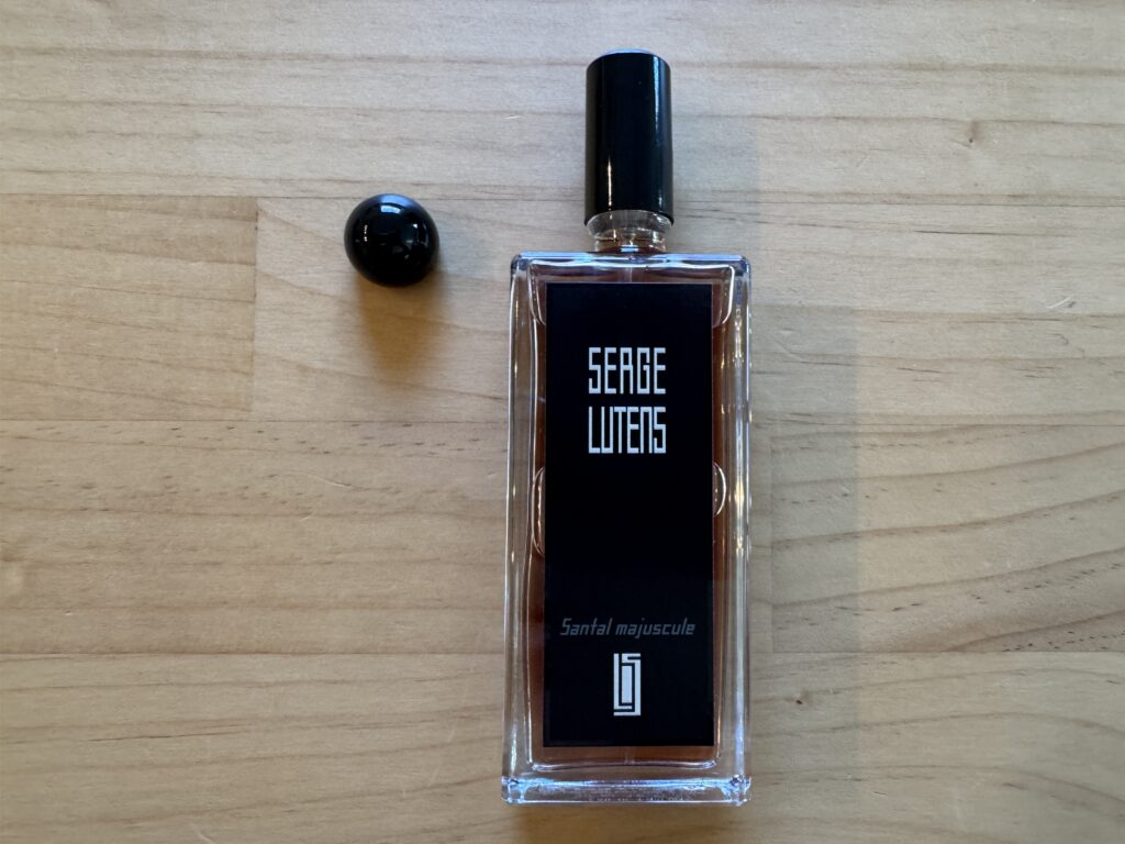 Serge Lutens Santal Majuscule perfume bottle front with spray nozzle