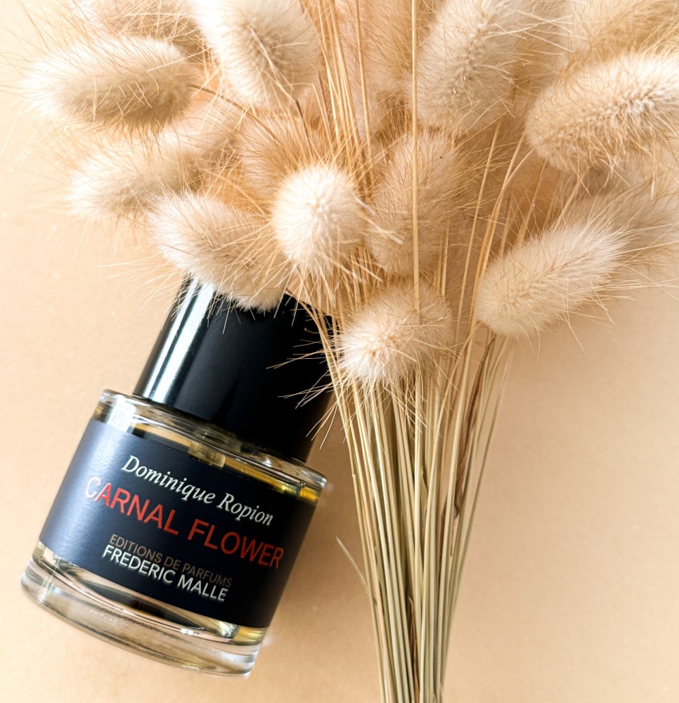 Carnal Flower perfume bottle with soft botanical texture