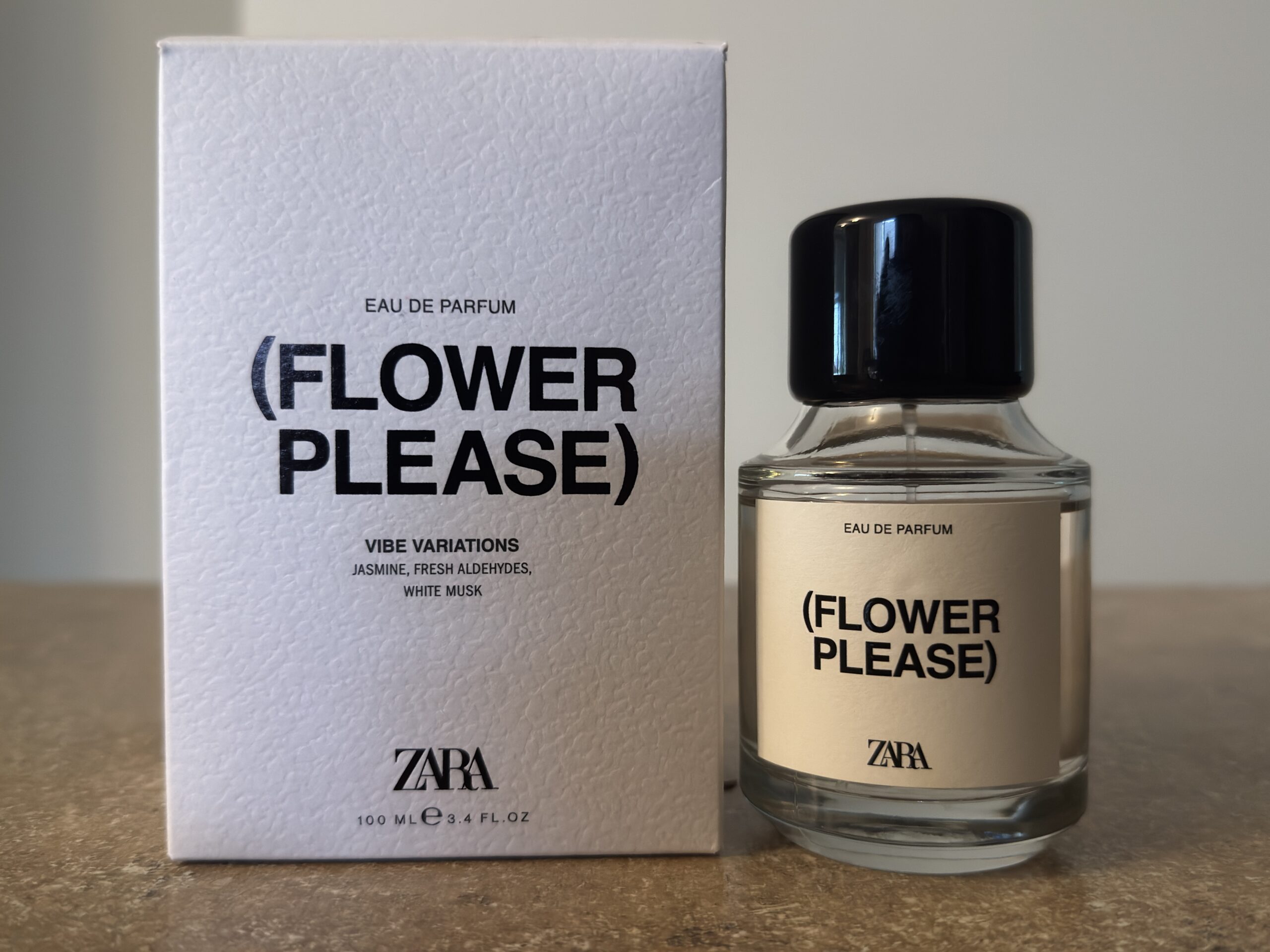 Zara Flower Please perfume bottle and packaging box photographed indoors in soft natural light