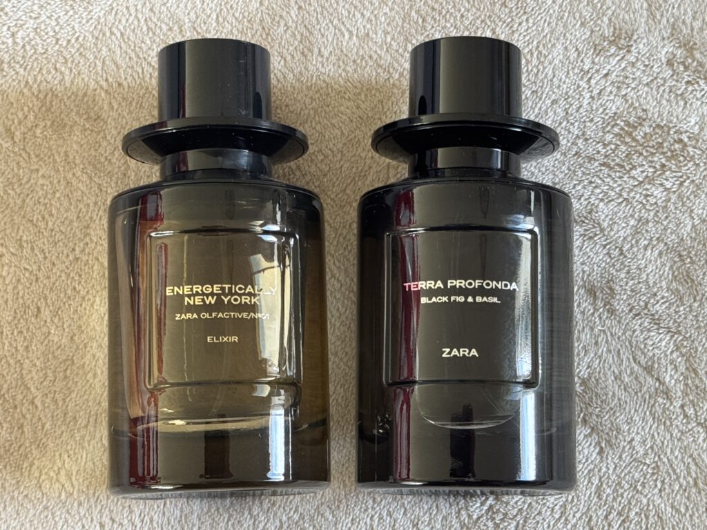 Zara Terra Profonda vs Energetically New York Elixir bottles lying on a carpet